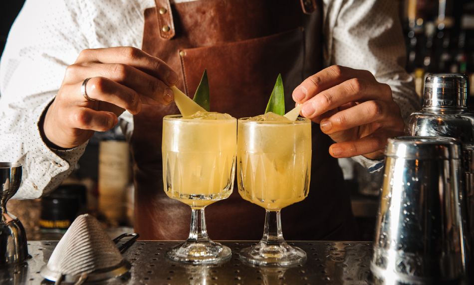 bartender adding lemons to drinks